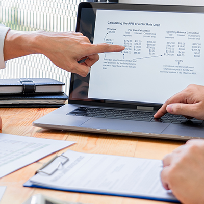Pointing to cost information on laptop screen
