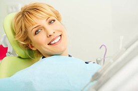 Smiling patient in dentist chair