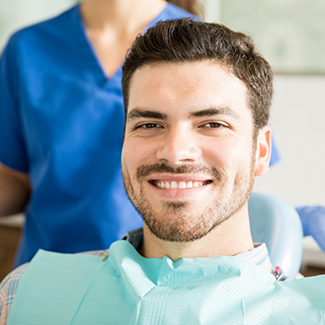 Man in dental chair smiling
