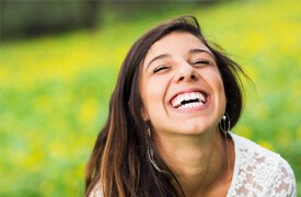 Woman with flawless smile outdoors