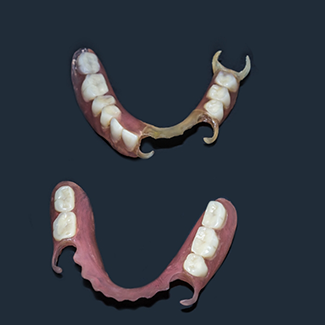 Partial dentures against black background