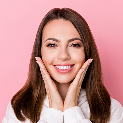Woman showing offer her smile after smile makeover