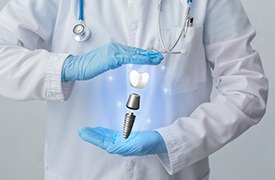 dentist with a hologram of a dental implant in their hands 