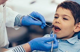 Little boy receiving dental exam