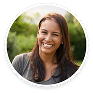 Woman with long hair smiling outside