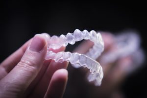 A pair of clear top and bottom retainers.