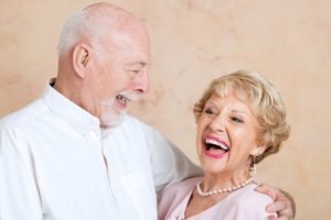 older couple smiling and embracing