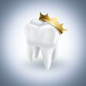 white tooth wearing golden crown