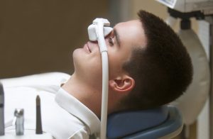 Man relaxing while using nitrous oxide sedation