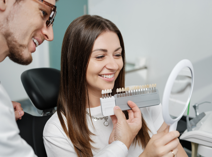 Dentist showing patient veneers